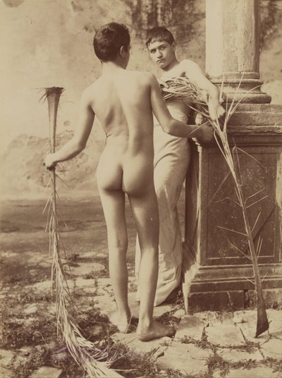 Two Male Youths Holding Palm Fronds by Baron Wilhelm von Gloeden
